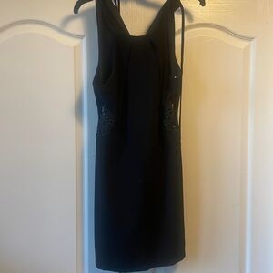 Black dress with lace cutouts on sides